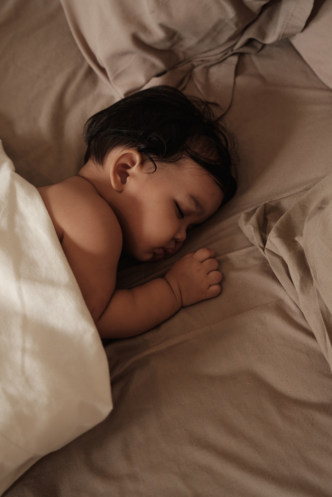 Baby Sleeping on the Bed